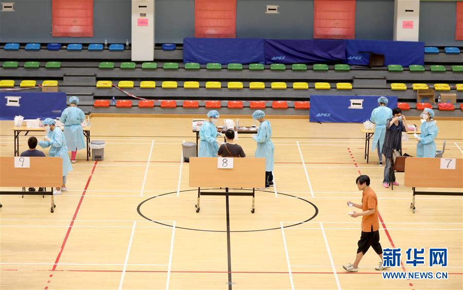 （圖文互動(dòng)）（4）“身為醫(yī)護(hù)人員一分子，應(yīng)該出來幫忙”——參與新冠病毒社區(qū)檢測的香港醫(yī)護(hù)人員速寫