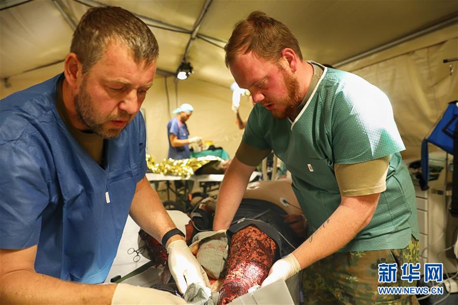 (國際·圖文互動)(5)“共同的理念,讓合作更深入更順暢”——走進中德“聯合救援-2019”衛勤實兵聯合演習德方野戰二級醫院